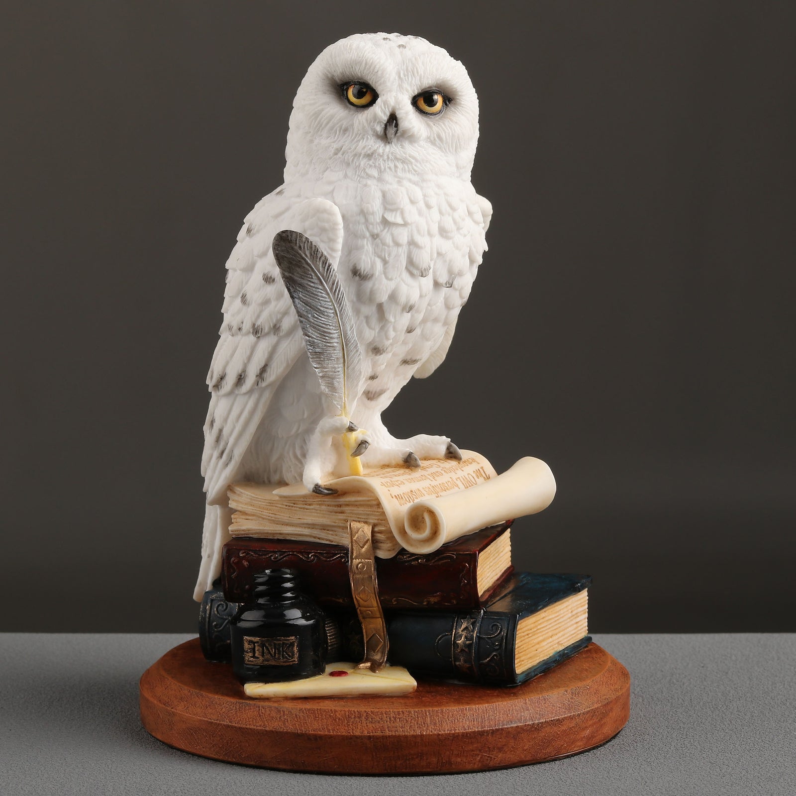 Snowy Owl Scripting On Top Of
Stack Of Books Statue