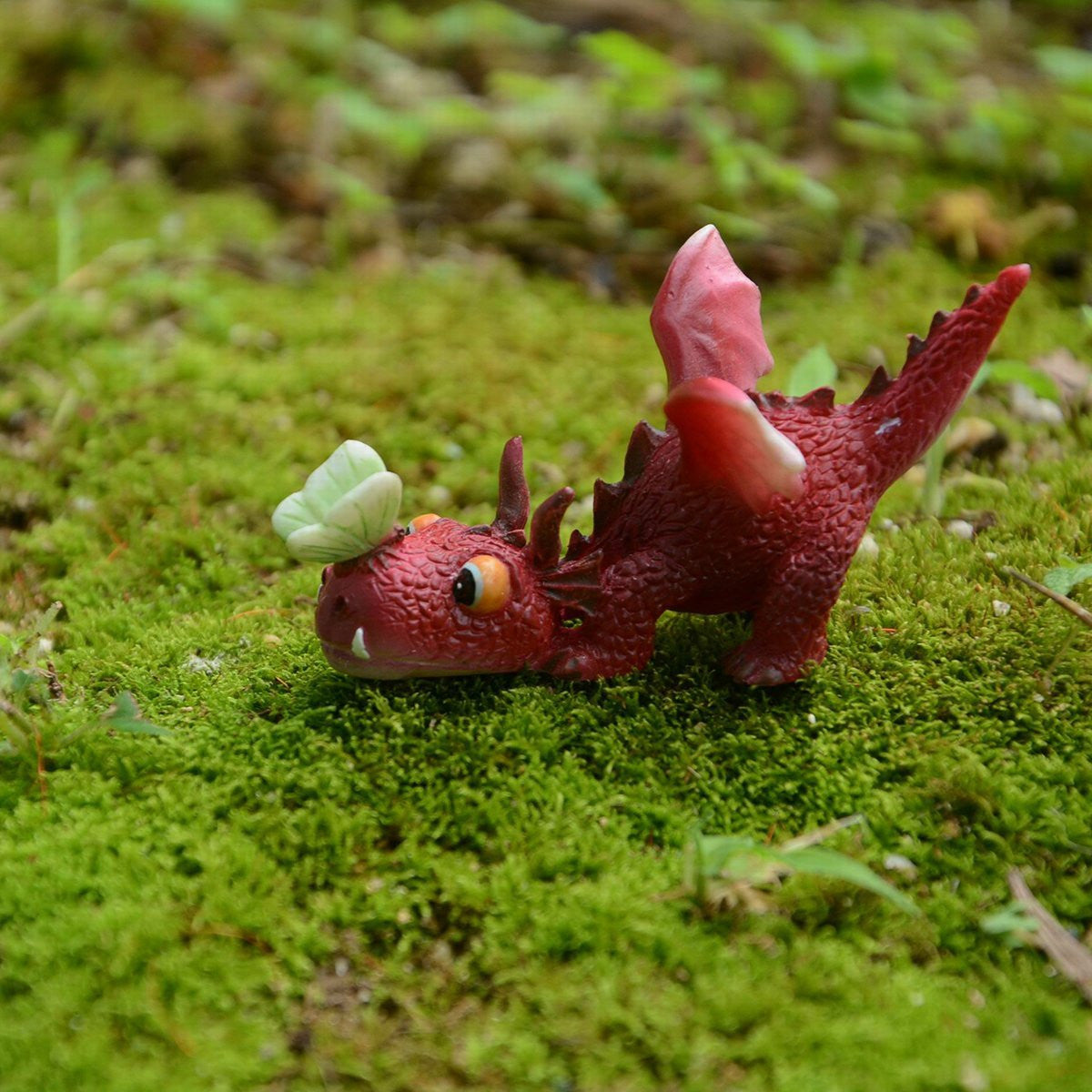 Mini Red Dragon Playing with Butterfly - Cast a Stone