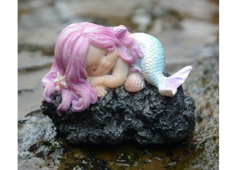 Sleeping Little mermaid on rock - Cast a Stone